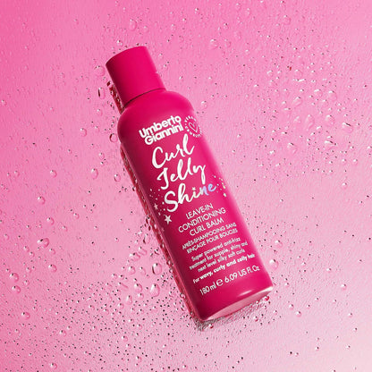 Umberto Giannini Curl Jelly Shine 180ml bottle on a pink surface with water droplets