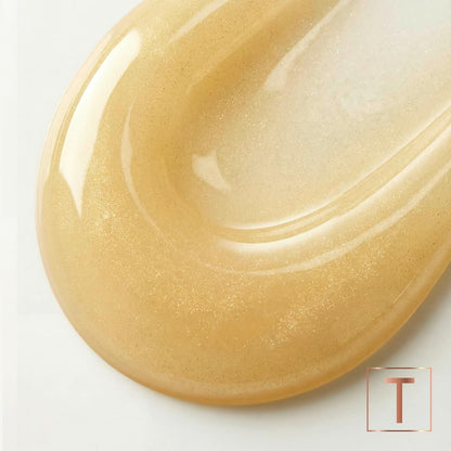 Close-up of a golden shampoo texture with the TRESemmé logo