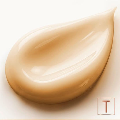 Close-up of a glossy, cream-colored conditioner swatch on a pale background.