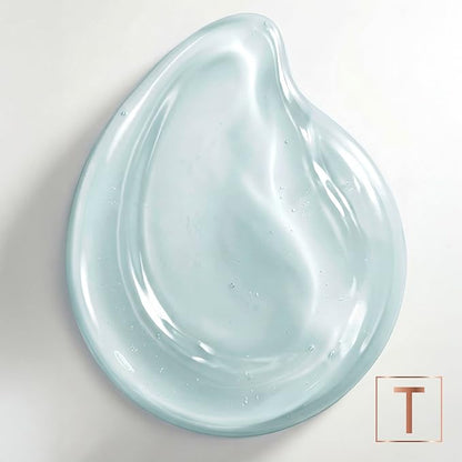 Close-up of a pale blue, translucent shampoo texture on a white background with the TRESemmé logo.